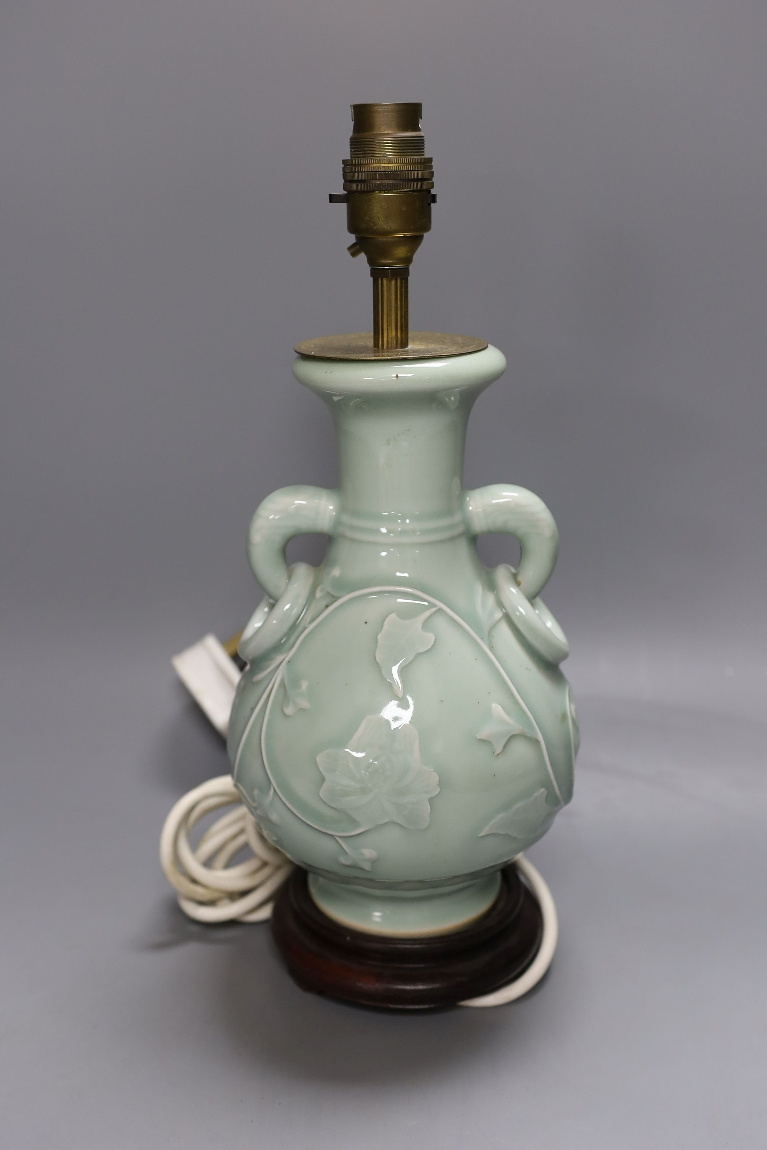 A Chinese celadon glazed two handled table lamp